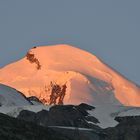 Allalin mit erster Sonne am 26.07. 07 von unserem Balkon in Saas Fee aus