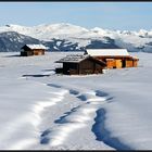 Alm Huts in the Snow