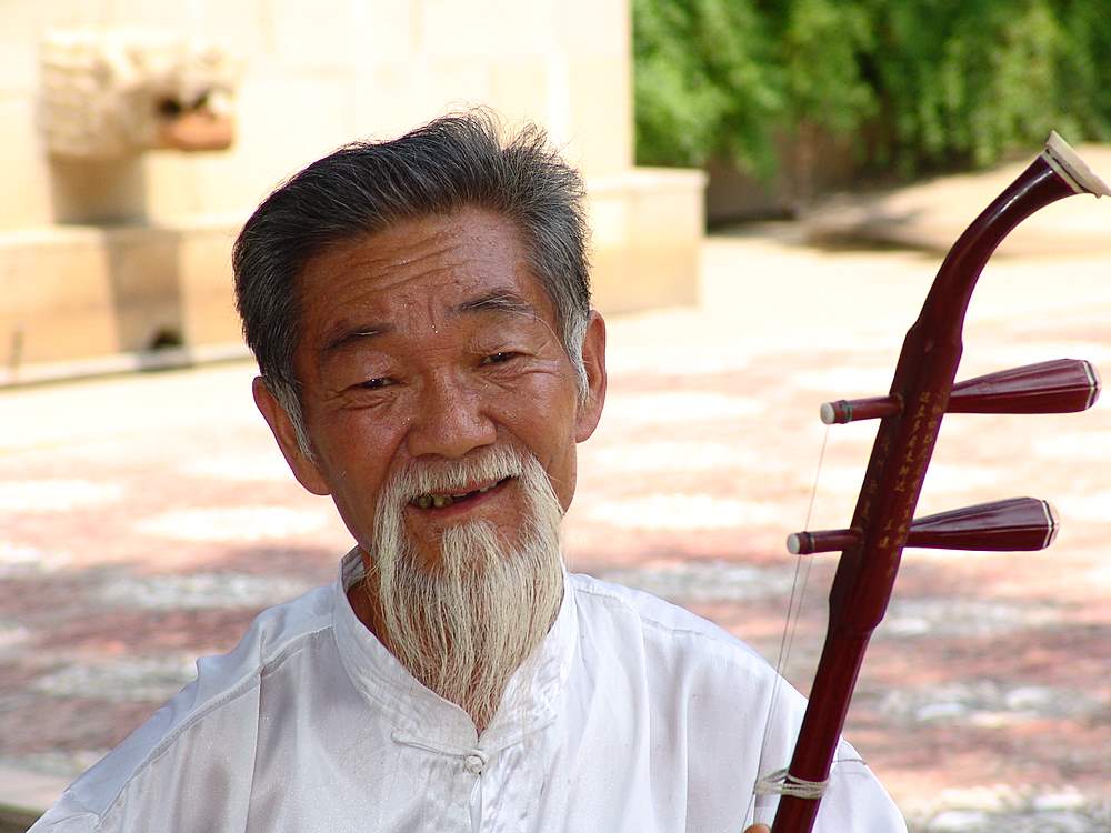 Alter Chinesischer Straßenmusikant