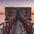 Altes Badehaus im Sonnenuntergang