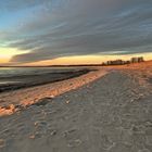 Am Strand bei Sonnenaufgang