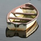 An empty boat on a calm river