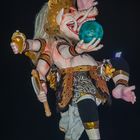 An Ogoh-Ogoh statue holds the globe