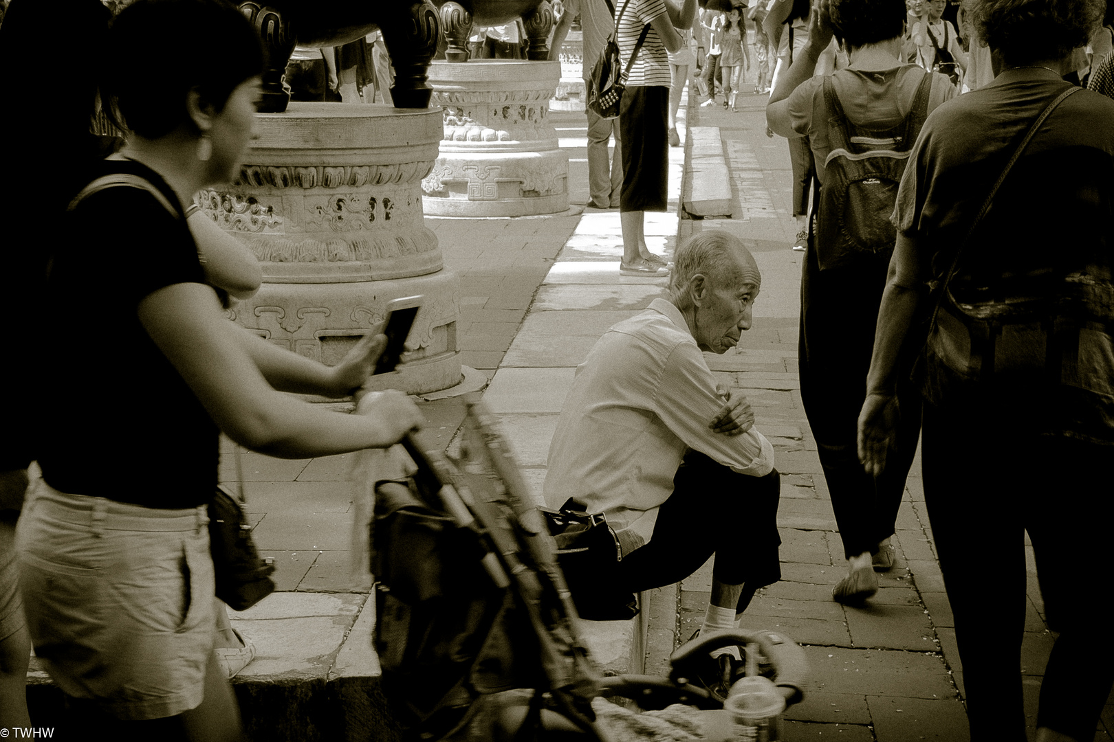 An Old Man In Front Of A Temple