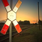 Andreaskreuz, Eisenbahnromantik, Schienen, regional, Norddeutschland, Abend