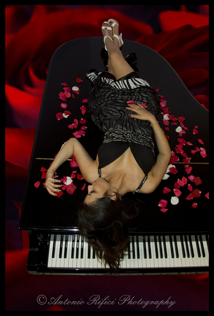 Angela on the piano with roses!