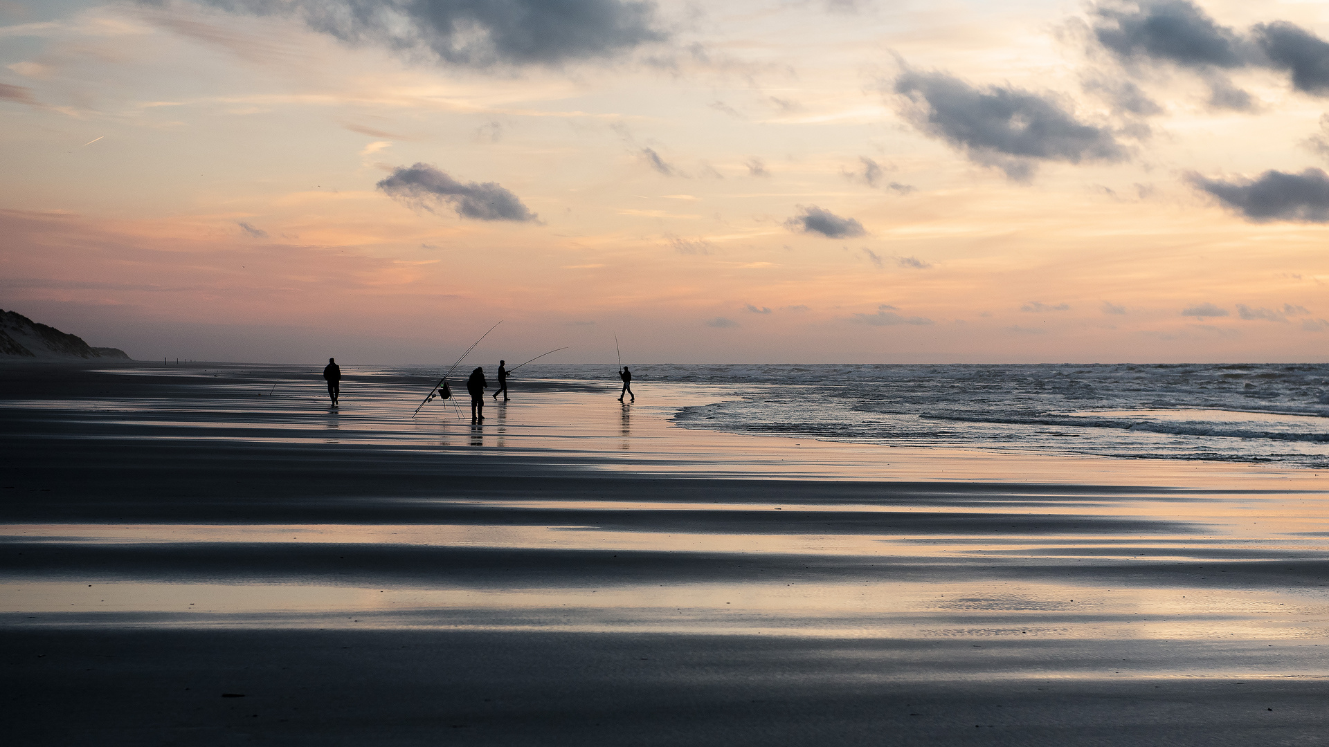 Angler am Strand