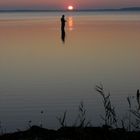 Angler bei Sonnenuntergang