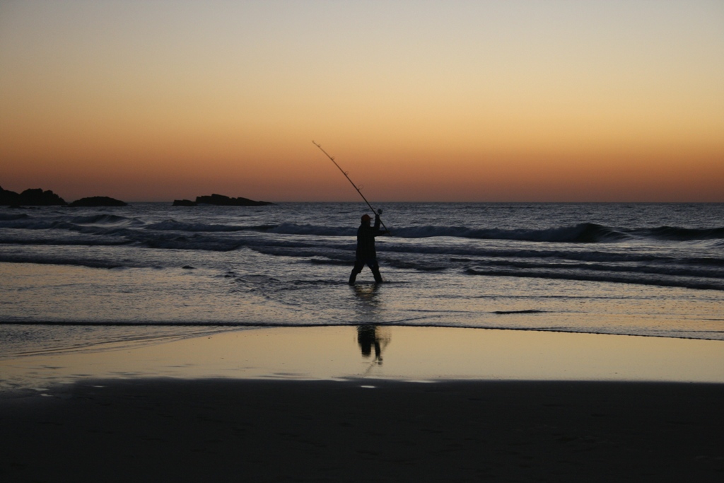 Angler beim Sonnenuntergang