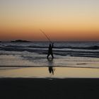 Angler beim Sonnenuntergang