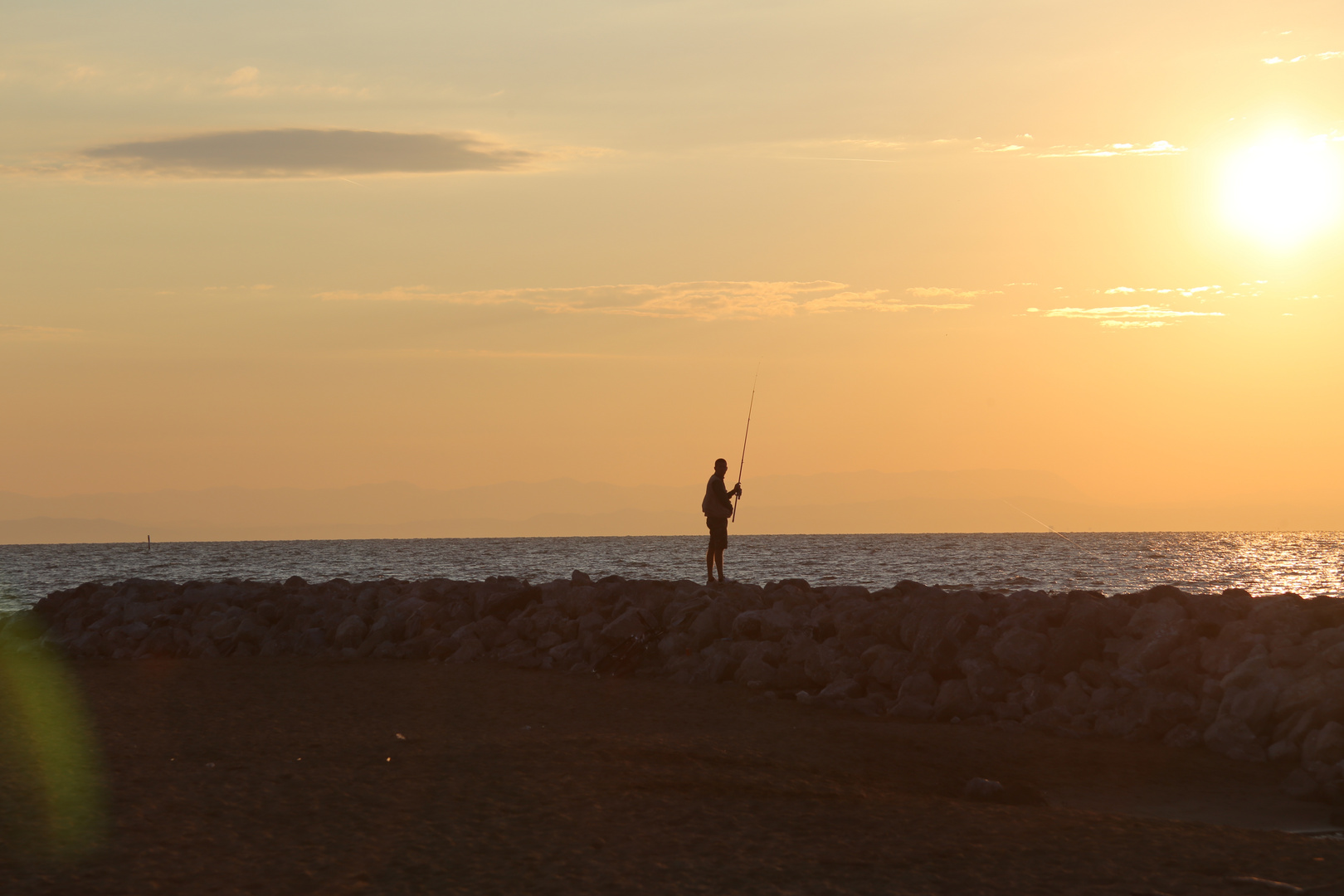 Angler im Morgenlicht