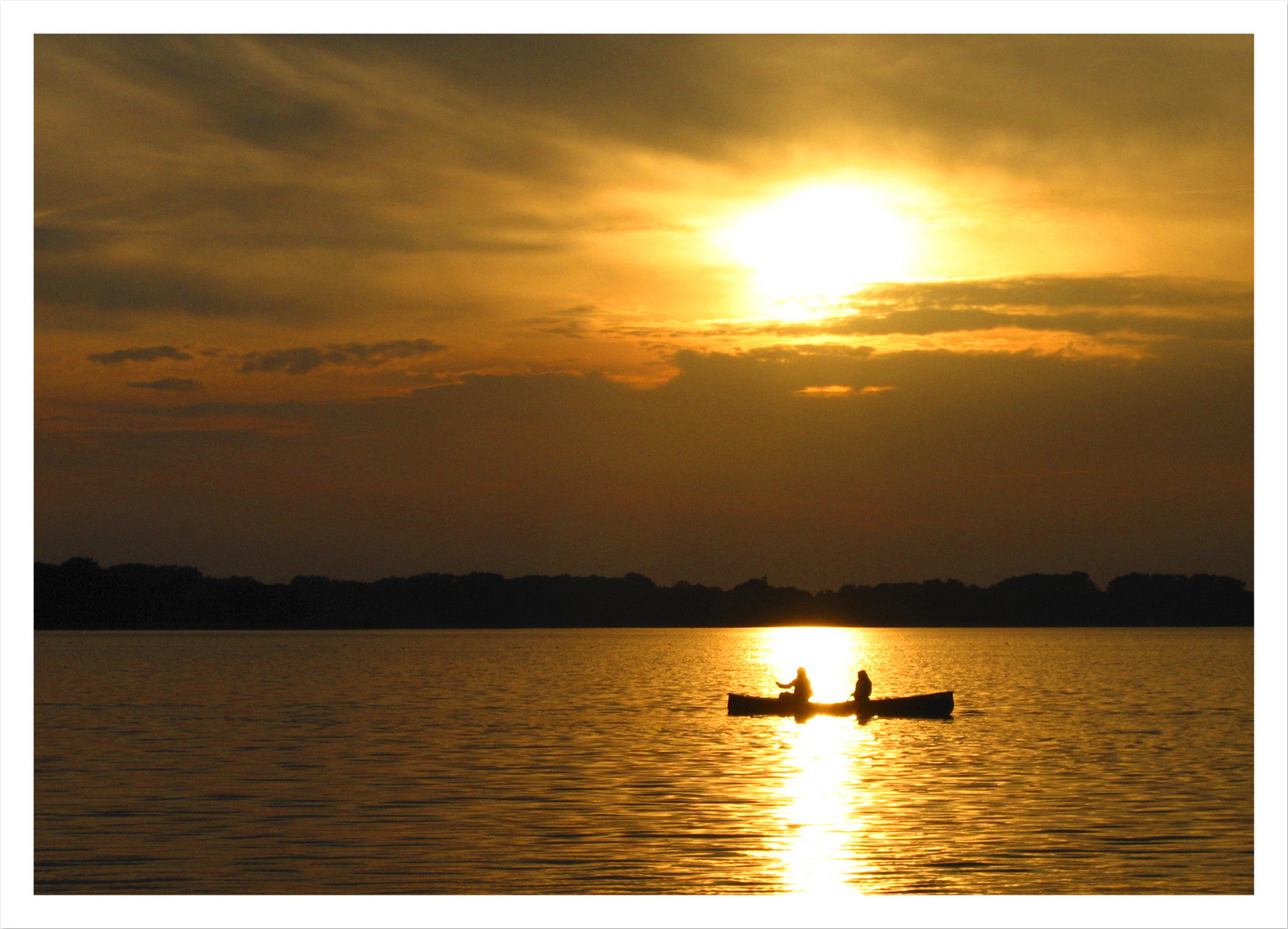 Angler im Sonnenuntergang