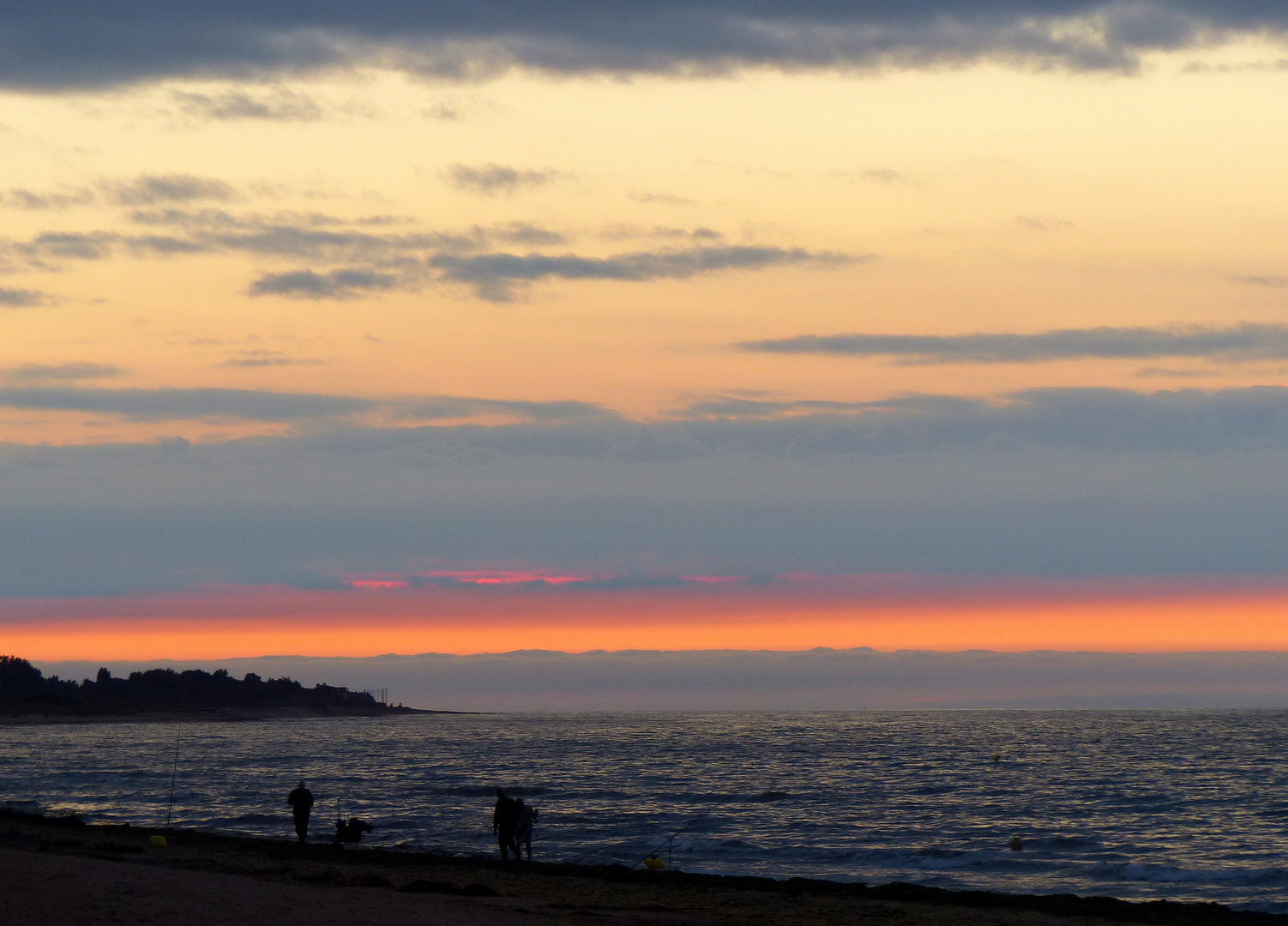 Anglers at sunset