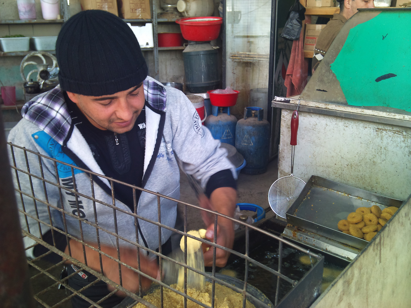 Arabic man making Falafel