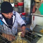 Arabic man making Falafel