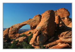 Arches, red rocks and a blue Sky