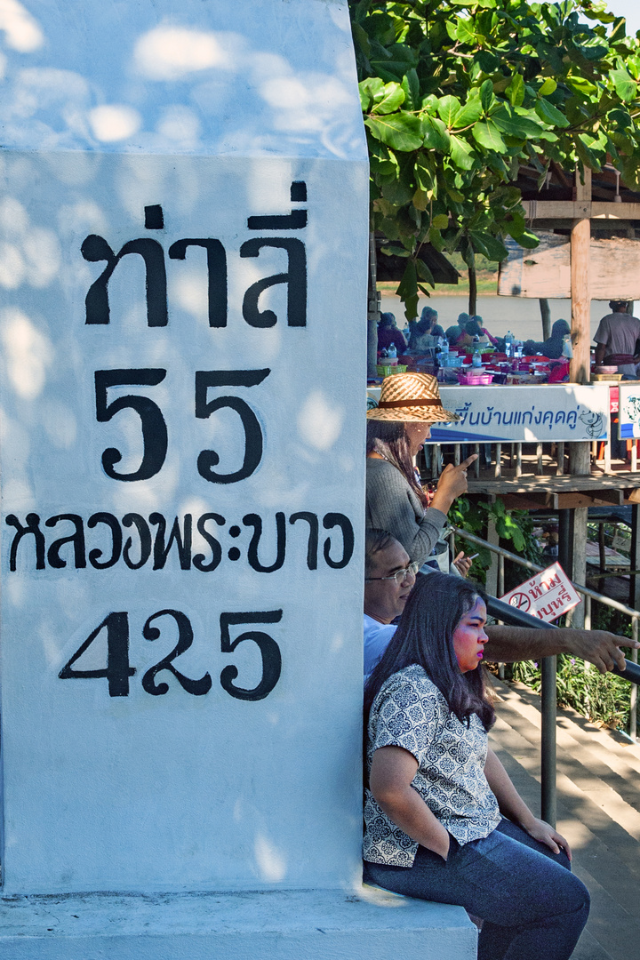 At the milestone in Kaeng Khut Khu