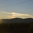 Atardecer y un timido arcoiris