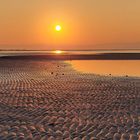 Aufgehende Sonne am Strand