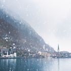 Austrian mountain town under snowfall