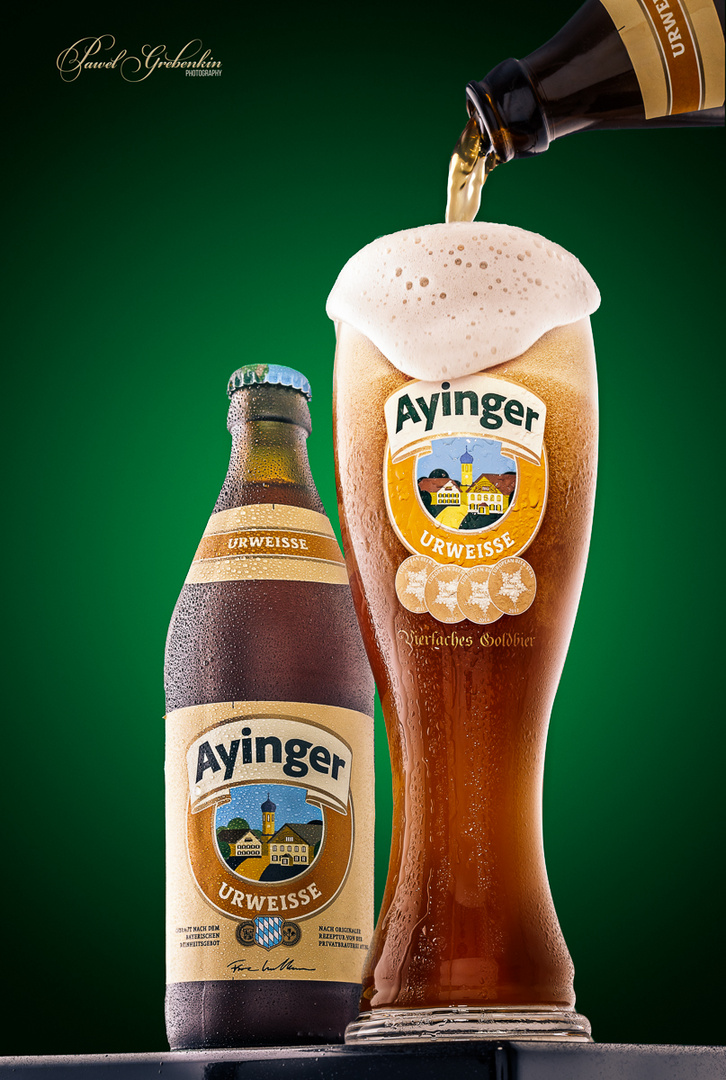 Ayinger wheat beer pouring in a glass