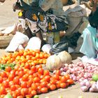 Baby and tomatos, Mombasa market, Kenya