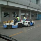 baggage tow tractor towing in Beijing Airport summer 2008