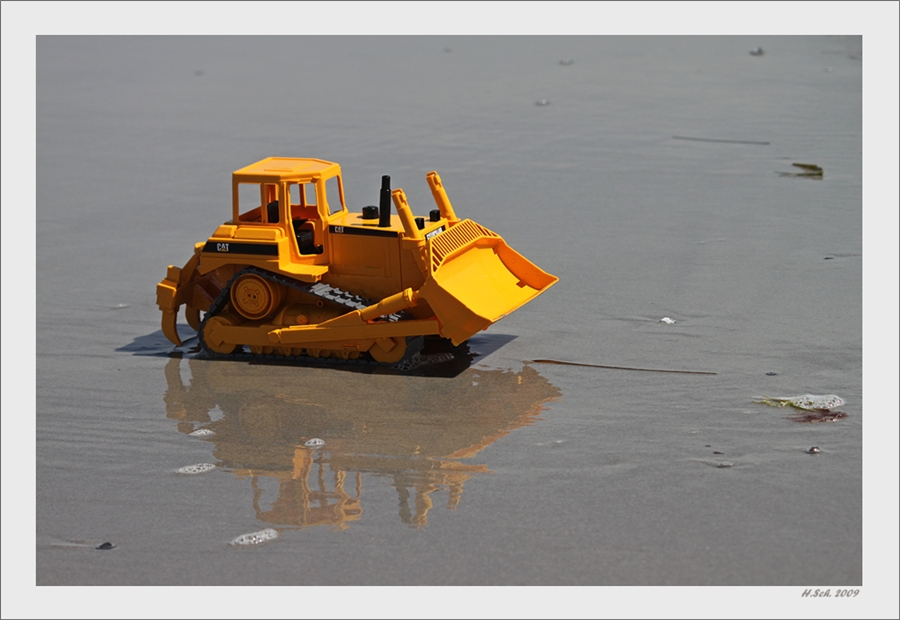 Baggern am Strand