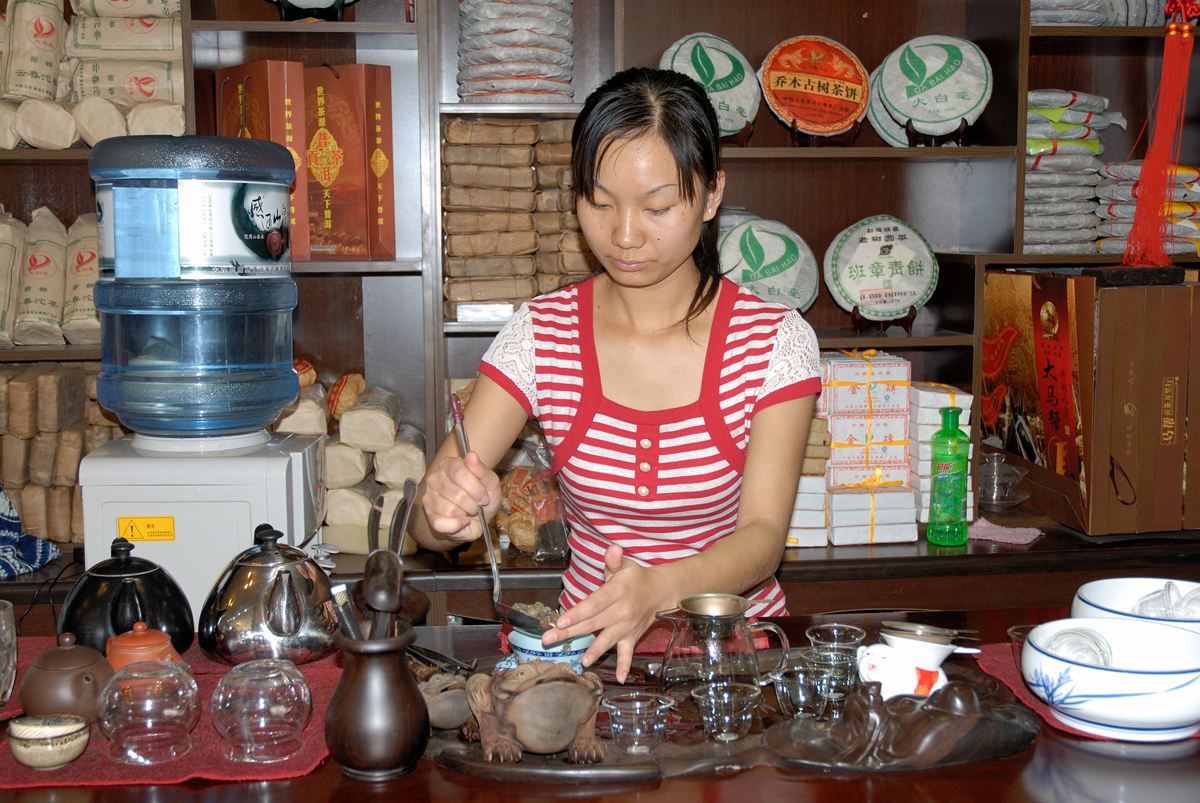 Bai girl preparing tea for us