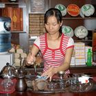 Bai girl preparing tea for us