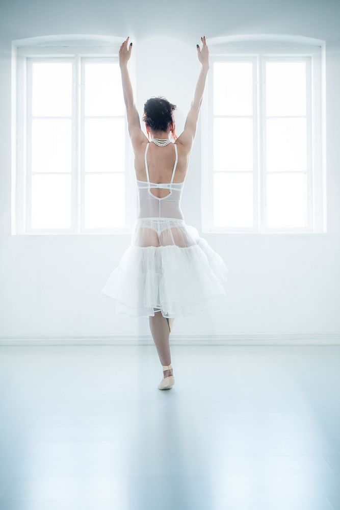 Ballerina in white room