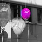 balloons behind glass