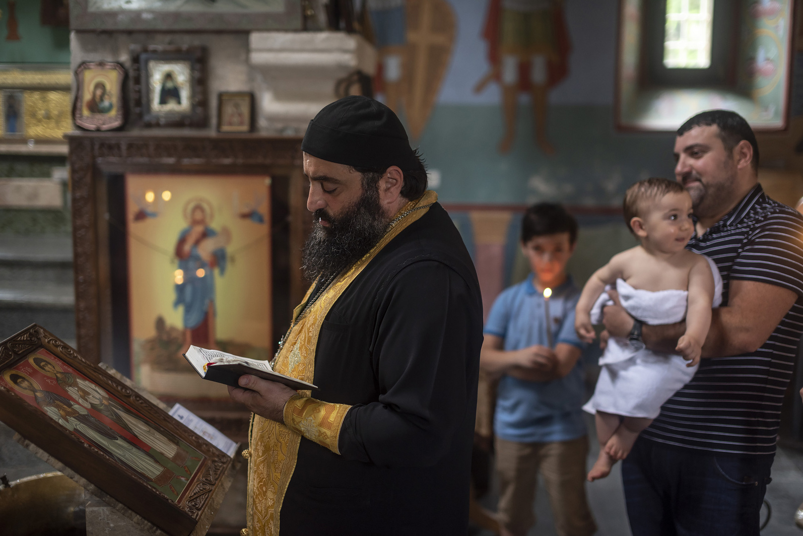 Baptising in Motsameta monastery