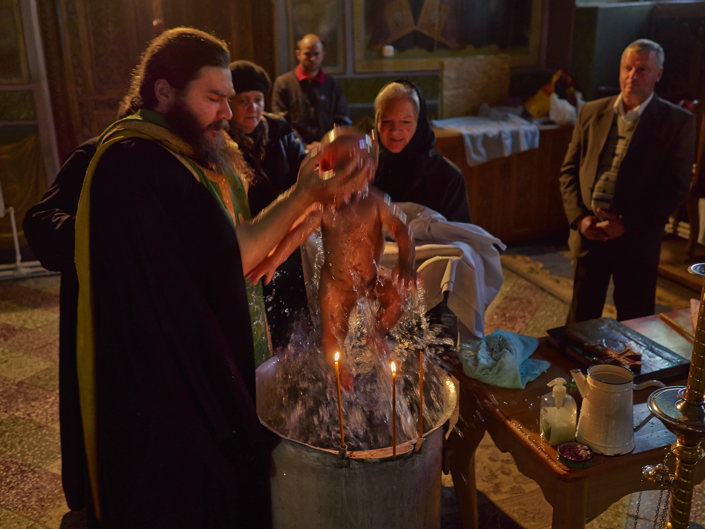 Baptism in The elixir of Holy Water Oils and Candle Light