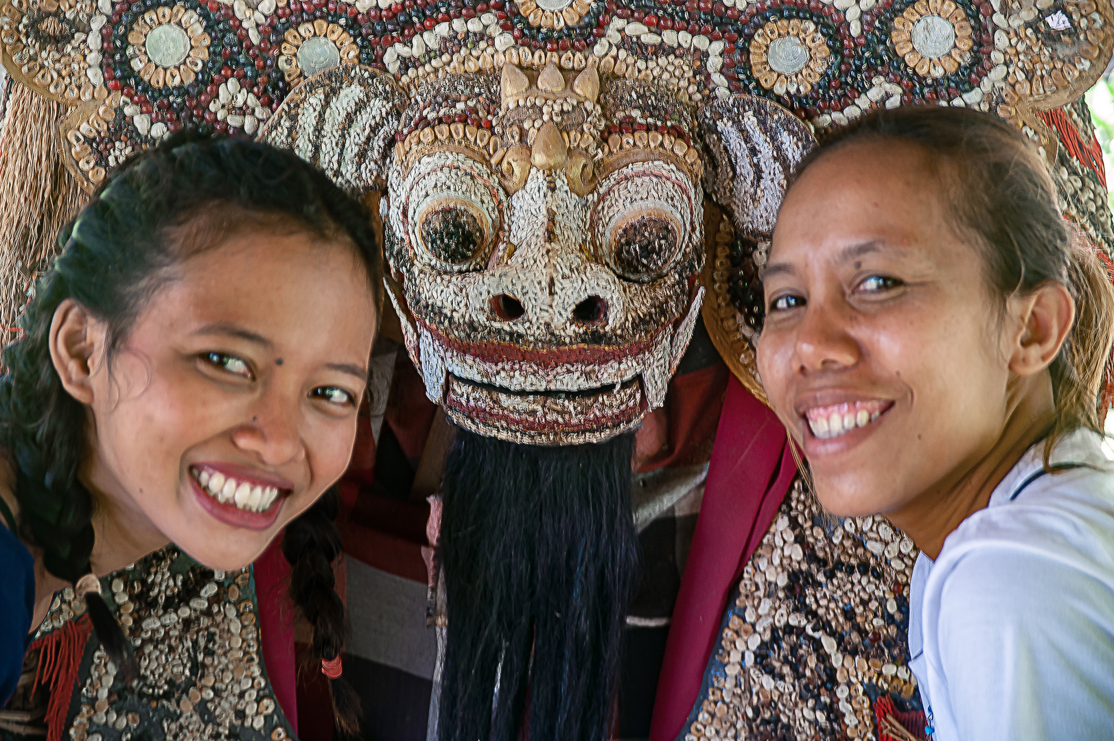 Barong figure between two ladies