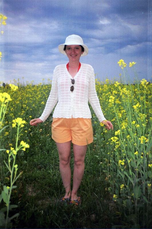 Beatiful woman on field background in Central Asia