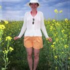 Beatiful woman on field background in Central Asia