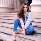 Beautiful caucasian woman sitting on stairs