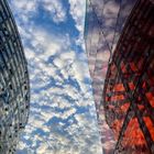 Beautiful clouds between the buildings 