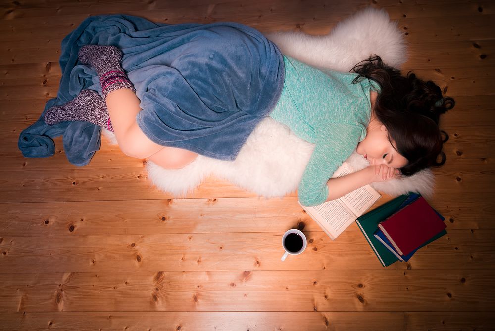 Beautiful girl fell asleep while reading