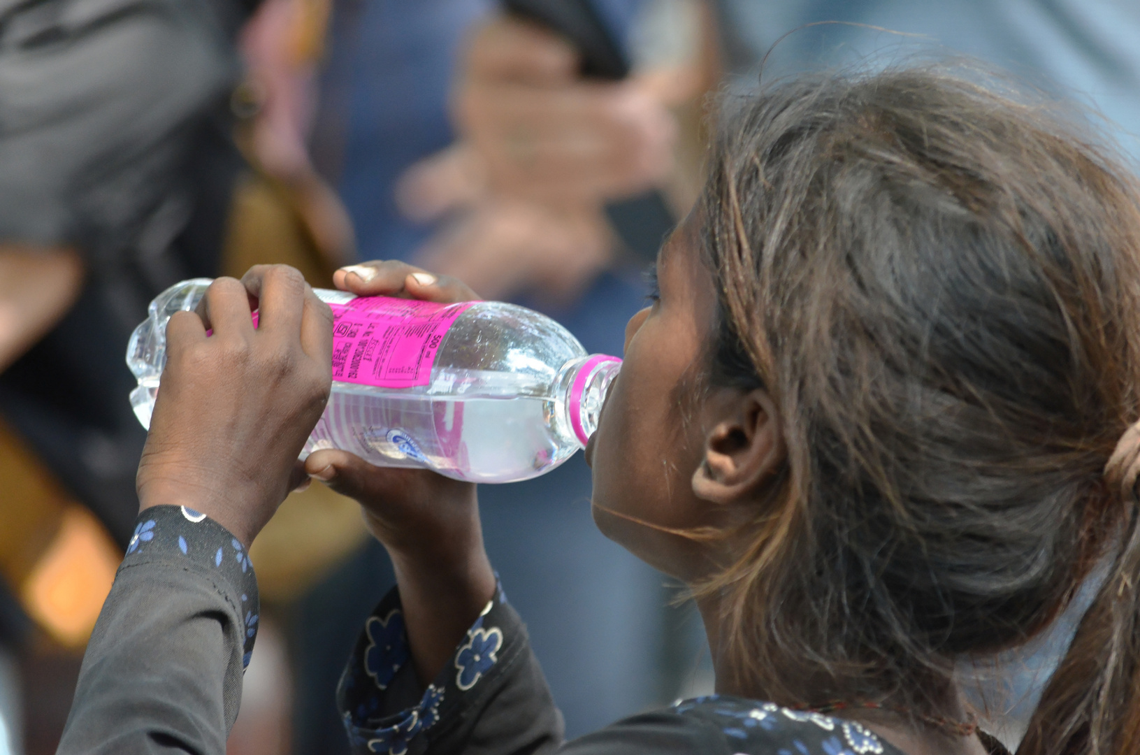 Beggar Girl drinking