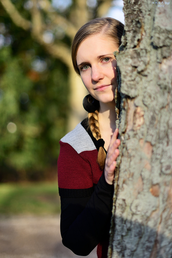 Behind the tree