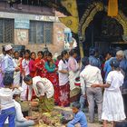 Believers give offerings to the Hindu deities