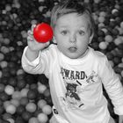 Ben at play house with red ball