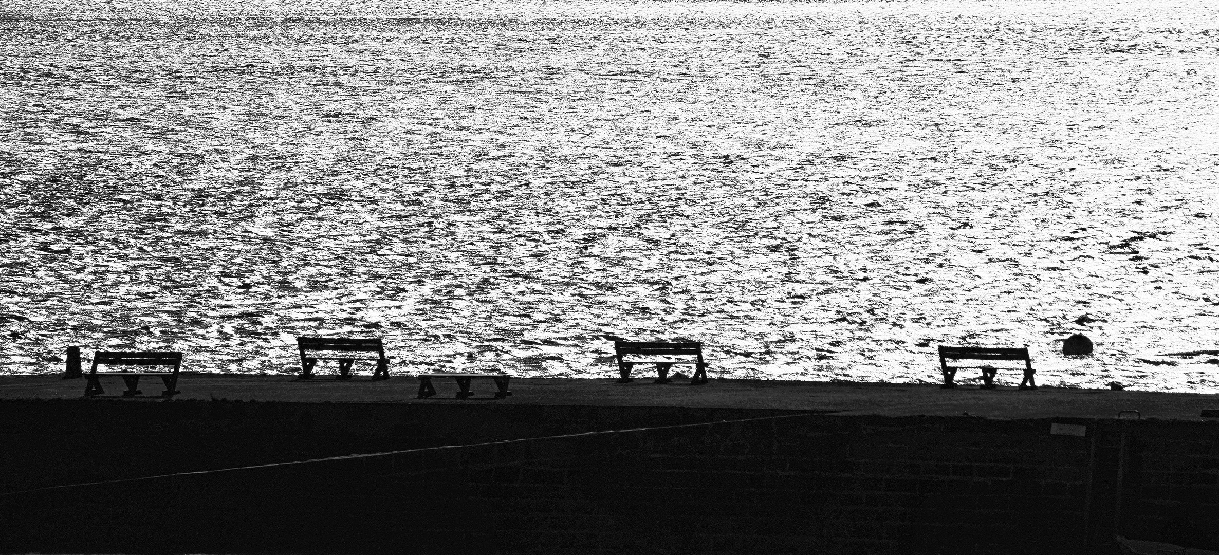 benches in front of the sea