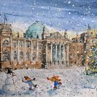 Berliner Reichstag zur winterlichen Weihnachtszeit mit spielenden Kindern