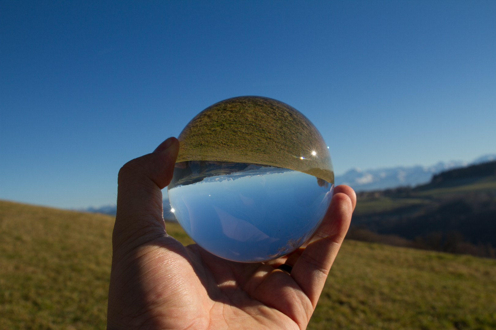 Bernese Alps in glass sphere