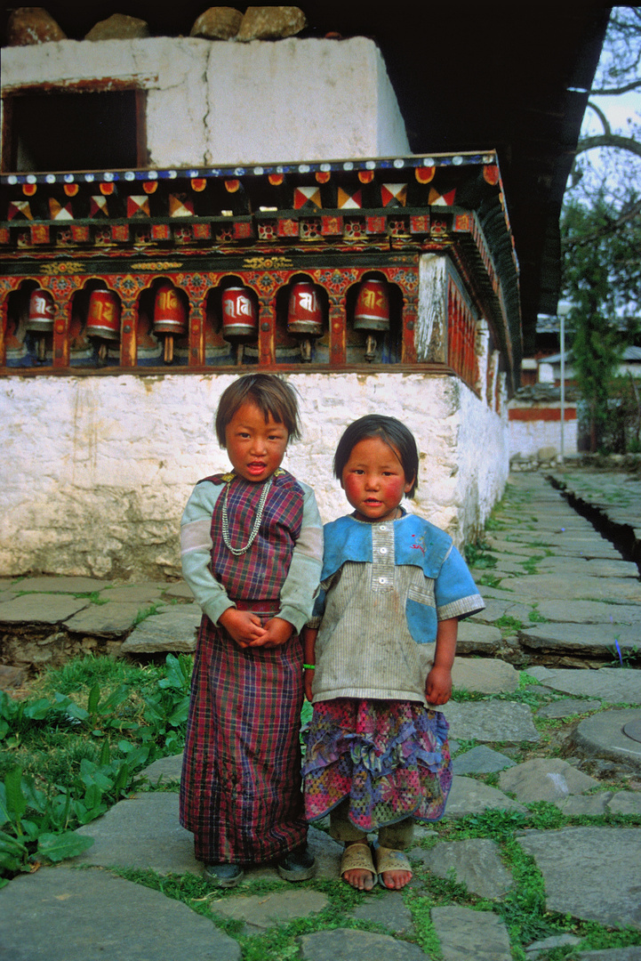 Bhutanese little ladies in the yard of the Kyichu Lhakhang monastery