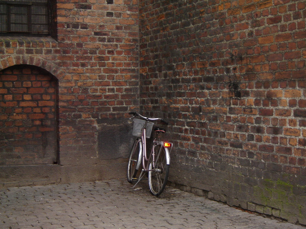 bicycle on a church's wall