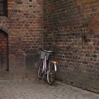 bicycle on a church's wall